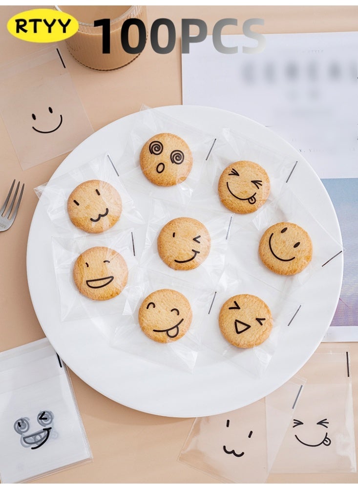 RTYY 100 كيس لاصق ذاتي للبسكويت، أكياس سيلوفان قابلة لإعادة الإغلاق، أكياس بلاستيكية مزينة بتعبيرات لطيفة لخبز البسكويت والحلوى، أكياس بلاستيكية شفافة للحلويات، أكياس تغليف فردية للحلوى، أكياس سيلوفان لتوزيعات الحفلات، لتغليف البسكويت والشوكولاتة والوجبات الخفيفة والمخبوزات (10 × 10 سم). - Image 1